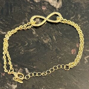 Gold Tone Infinity Bracelet. Never worn.